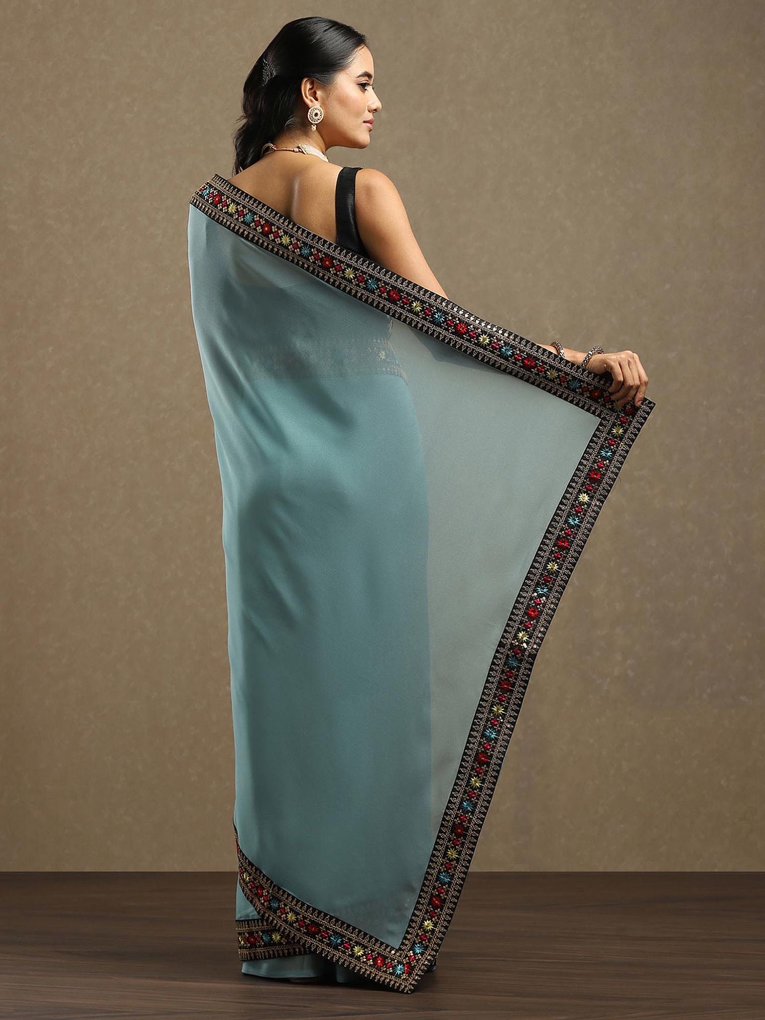 Aqua Blue Georgette Saree with Embroidered Sequined Border