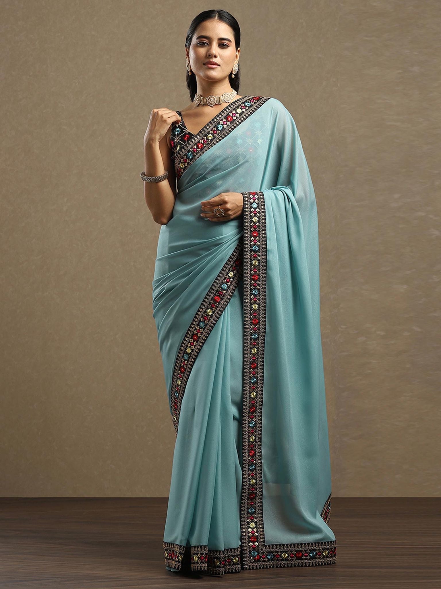 Aqua Blue Georgette Saree with Embroidered Sequined Border
